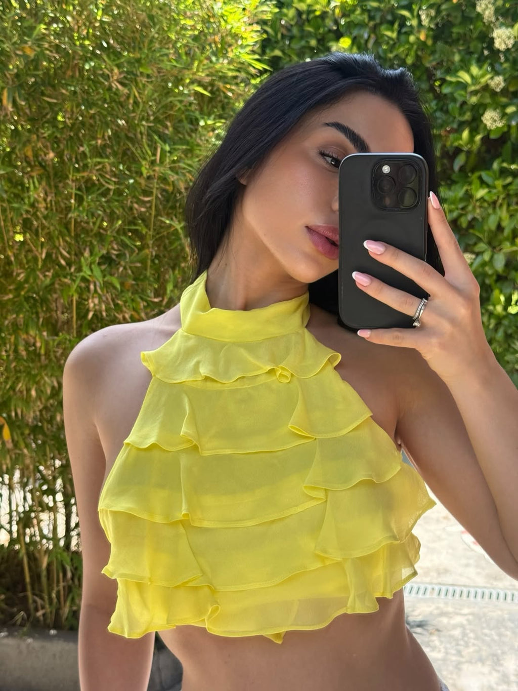 Halter neck top with ruffle detail. Open back 💛