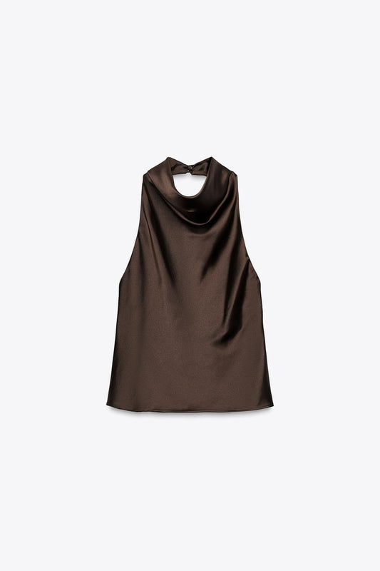 Halter neck top with open back. Back hidden button closure.