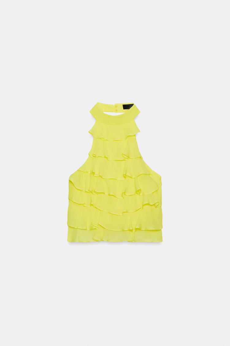 Halter neck top with ruffle detail. Open back 💛